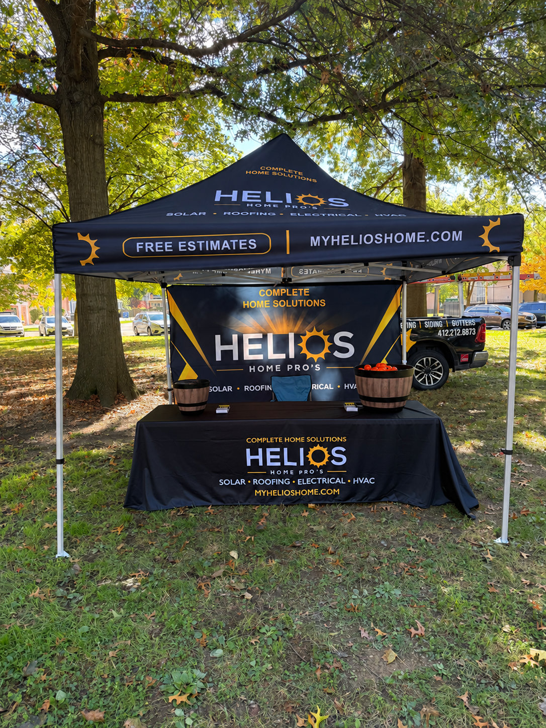 Helios branded tent and display at an outdoor event