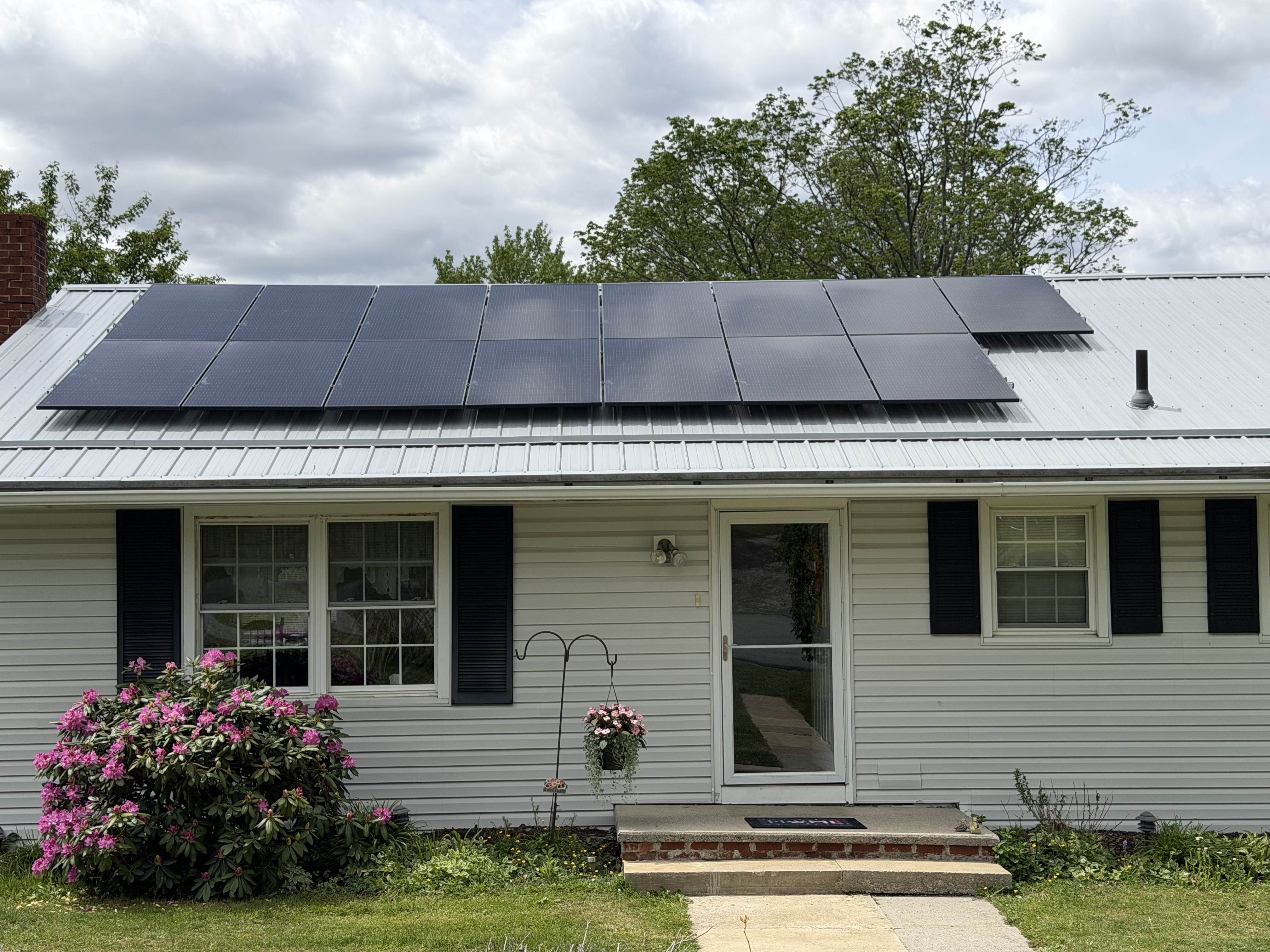 Solar panels installed on a metal-roof home.